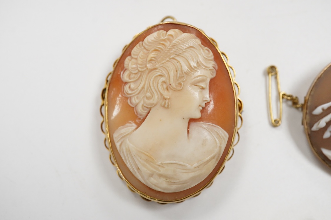 A collection of jewels, comprising: an Art Deco green and colourless paste jabot pin; two shell cameo brooches, depicting a lady in profile, length 4.7cm, stamped 9ct, and Sol's chariot respectively; and a gilt metal and
